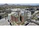 An aerial view of modern building with a rooftop patio in a vibrant city setting at 4808 N 24Th St # 1305, Phoenix, AZ 85016