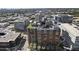 A high-angle view of the apartment building showcasing the rooftop lounge area in an urban setting at 4808 N 24Th St # 1305, Phoenix, AZ 85016