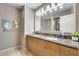 Modern bathroom featuring double sinks, a marble countertop, and well-lit vanity at 4808 N 24Th St # 1305, Phoenix, AZ 85016
