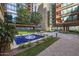 Outdoor courtyard area with a fountain, seating, and professionally landscaped grounds at 4808 N 24Th St # 1305, Phoenix, AZ 85016
