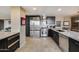 Modern kitchen with stainless steel appliances, marble countertops, and sleek cabinetry for an upgraded living experience at 4808 N 24Th St # 1305, Phoenix, AZ 85016