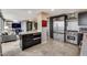 Open kitchen design with stainless steel appliances, marble countertops, and a convenient center island at 4808 N 24Th St # 1305, Phoenix, AZ 85016