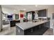 Well-lit kitchen featuring an island, stainless steel appliances, marble countertops, and modern finishes at 4808 N 24Th St # 1305, Phoenix, AZ 85016