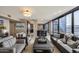 Stylish living room with open floor plan, modern decor, comfortable seating, and a view of the kitchen at 4808 N 24Th St # 1305, Phoenix, AZ 85016