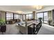 Spacious living room with large windows showcasing city and water views, and comfortable seating arrangements at 4808 N 24Th St # 1305, Phoenix, AZ 85016
