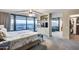 Bright main bedroom featuring floor-to-ceiling windows, city views, and an ensuite bathroom at 4808 N 24Th St # 1305, Phoenix, AZ 85016