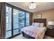 Bright bedroom with a view featuring a large window and cozy decor at 4808 N 24Th St # 1305, Phoenix, AZ 85016