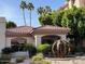 Beautiful building exterior featuring lush landscaping and a unique water feature and monument at 5104 N 32Nd St # 431, Phoenix, AZ 85018