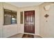 Inviting entrance to unit 431 with a rich, dark door, side window, and textured wall at 5104 N 32Nd St # 431, Phoenix, AZ 85018