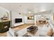 Inviting living room showcasing a sleek fireplace, comfortable seating, and an open layout leading to the dining area at 5104 N 32Nd St # 431, Phoenix, AZ 85018