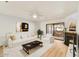 Cozy living room with a fireplace, a comfortable sofa, and a sliding glass door with outdoor light at 5104 N 32Nd St # 431, Phoenix, AZ 85018