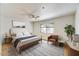 Serene main bedroom with a large window, ceiling fan, and stylish decor at 5104 N 32Nd St # 431, Phoenix, AZ 85018