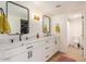 Bathroom with dual sinks, marble countertops, and modern black hardware at 5122 N 31St Way # 238, Phoenix, AZ 85016