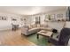 Bright and airy living room featuring a comfortable sofa, modern decor, and an open floor plan at 5122 N 31St Way # 238, Phoenix, AZ 85016
