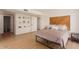 Cozy main bedroom featuring a rustic wood headboard and warm, neutral tones at 5122 N 31St Way # 238, Phoenix, AZ 85016