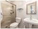 Well-lit bathroom with a glass-enclosed shower and pedestal sink at 5910 N 86Th St, Scottsdale, AZ 85250