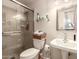 Modern bathroom featuring a glass-enclosed shower, stylish vanity, and contemporary fixtures at 5910 N 86Th St, Scottsdale, AZ 85250