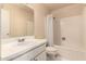 Cozy bathroom with a single sink vanity, a framed mirror and a shower-tub combo at 5910 N 86Th St, Scottsdale, AZ 85250