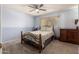 Comfortable bedroom with a ceiling fan and neutral-toned walls at 5910 N 86Th St, Scottsdale, AZ 85250