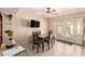 Bright dining area with a ceiling fan and double doors leading to the outside at 5910 N 86Th St, Scottsdale, AZ 85250