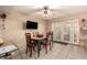 Cozy dining area with a ceiling fan, adjacent to the kitchen, and featuring sliding doors to the backyard at 5910 N 86Th St, Scottsdale, AZ 85250