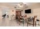 Cozy dining area with a ceiling fan, adjacent to the kitchen, and featuring a dining table and chairs at 5910 N 86Th St, Scottsdale, AZ 85250
