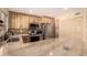 Modern kitchen with granite countertops, stainless steel appliances, and light wood cabinetry at 5910 N 86Th St, Scottsdale, AZ 85250