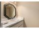 Cozy powder room featuring a decorative mirror and stylish vanity at 5910 N 86Th St, Scottsdale, AZ 85250