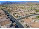Sweeping aerial view of a desert community, featuring golf course, houses, and mountain backdrop at 6513 S Fairway Dr, Gold Canyon, AZ 85118