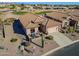 Aerial view of a charming home with tile roof, desert landscaping, and inviting patio at 6513 S Fairway Dr, Gold Canyon, AZ 85118