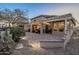 Spacious backyard with a covered patio, desert landscaping, and ample space for outdoor enjoyment at 6513 S Fairway Dr, Gold Canyon, AZ 85118