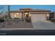 Beautiful single-story home featuring desert landscaping and a convenient two-car garage at 6513 S Fairway Dr, Gold Canyon, AZ 85118
