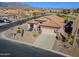 Inviting home with desert landscaping, covered patio, and an attached two-car garage at 6513 S Fairway Dr, Gold Canyon, AZ 85118