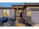 Inviting front entrance with stone accents, desert landscaping, and a cozy front patio at 6513 S Fairway Dr, Gold Canyon, AZ 85118