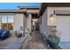 Inviting front entrance with stone accents, desert plants, and a security system sign at 6513 S Fairway Dr, Gold Canyon, AZ 85118