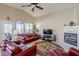 Spacious living room features vaulted ceilings, a fireplace, and views of the outdoor space at 6513 S Fairway Dr, Gold Canyon, AZ 85118