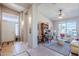 Bright and airy open-concept living room and entry area with high ceilings and tile floors at 6513 S Fairway Dr, Gold Canyon, AZ 85118