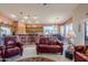 Open living space with a kitchen featuring stainless appliances, and dining area with large window views at 6513 S Fairway Dr, Gold Canyon, AZ 85118
