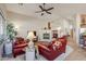 Inviting living room featuring vaulted ceilings, a cozy fireplace, and comfortable seating at 6513 S Fairway Dr, Gold Canyon, AZ 85118