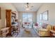 Comfortable living room featuring a cozy seating area, ceiling fan and desk at 6513 S Fairway Dr, Gold Canyon, AZ 85118