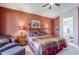 Comfortable bedroom with a four-poster bed, bedside tables with lamps, and an ensuite bath at 6513 S Fairway Dr, Gold Canyon, AZ 85118