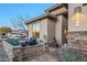Cozy front patio with comfortable seating, stone accents, and a well-manicured garden at 6513 S Fairway Dr, Gold Canyon, AZ 85118