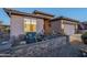 Cozy front patio with comfortable seating, stone accents, and desert landscaping at 6513 S Fairway Dr, Gold Canyon, AZ 85118