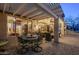 Charming outdoor patio with a dining area, comfortable seating, and inviting covered space at 6513 S Fairway Dr, Gold Canyon, AZ 85118