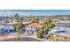 A high angle view captures a charming blue home with a brown roof, surrounded by lush trees and vibrant landscaping at 654 S 83Rd Way, Mesa, AZ 85208