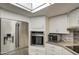 Stainless steel refrigerator, built-in oven, and microwave complement the stylish kitchen at 654 S 83Rd Way, Mesa, AZ 85208