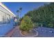 Landscaped backyard featuring lush greenery, citrus trees, and a patio at 654 S 83Rd Way, Mesa, AZ 85208