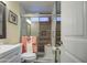 Modern bathroom featuring a glass-enclosed shower and wood look accent tiles at 654 S 83Rd Way, Mesa, AZ 85208