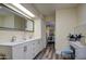 Bright bathroom with double sink vanity and access to the bedroom at 654 S 83Rd Way, Mesa, AZ 85208