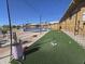 Well-maintained batting cage area with a view of outdoor pickleball courts for a variety of recreational activities at 654 S 83Rd Way, Mesa, AZ 85208
